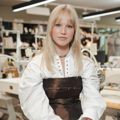 Portrait of H&M design intern sitting in the design studio at Stockholm Head Office