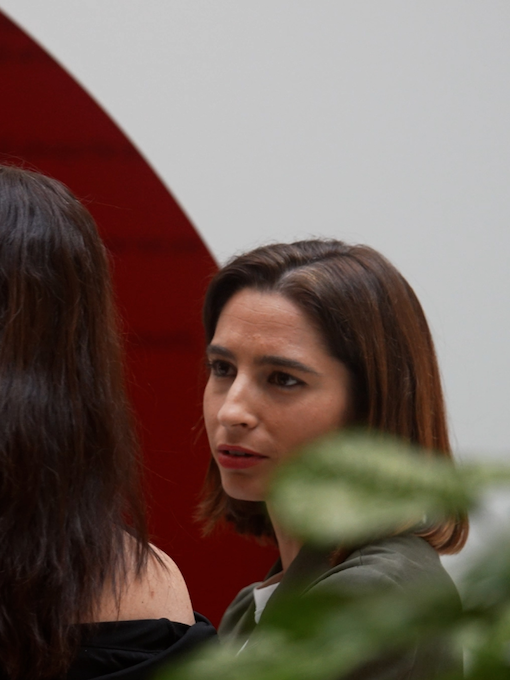 Two female colleagues engaged in conversation during an Inclusion & Diversity summit at H&M's head office.