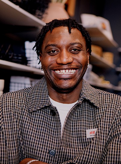 Male store employee smiling looking at the camera