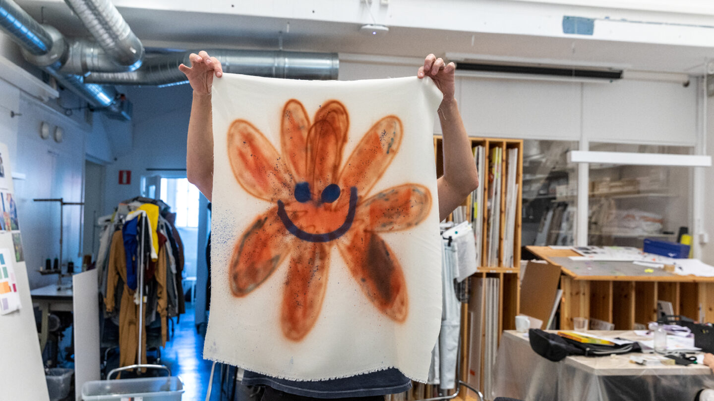 Studio where someone is experimenting with patterns and prints on fabric, showcasing H&M Group’s creative brands.