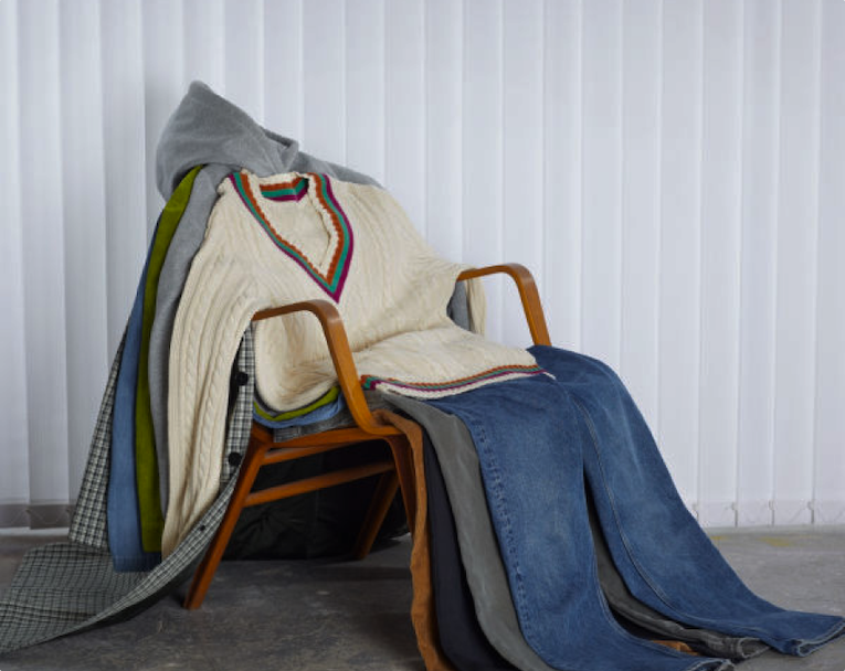 Clothes displayed on a stool, associated with H&M’s rental, repair, and second-hand services.